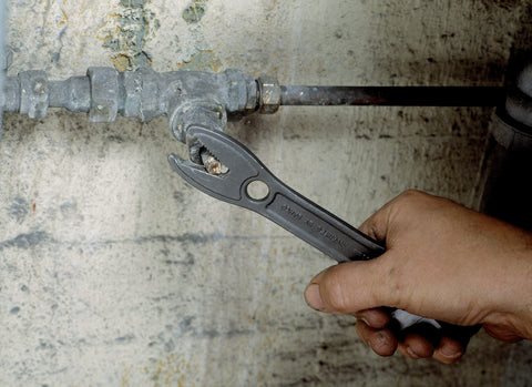 Bahco Alligator wrench gripping a pipe for a secure hold.