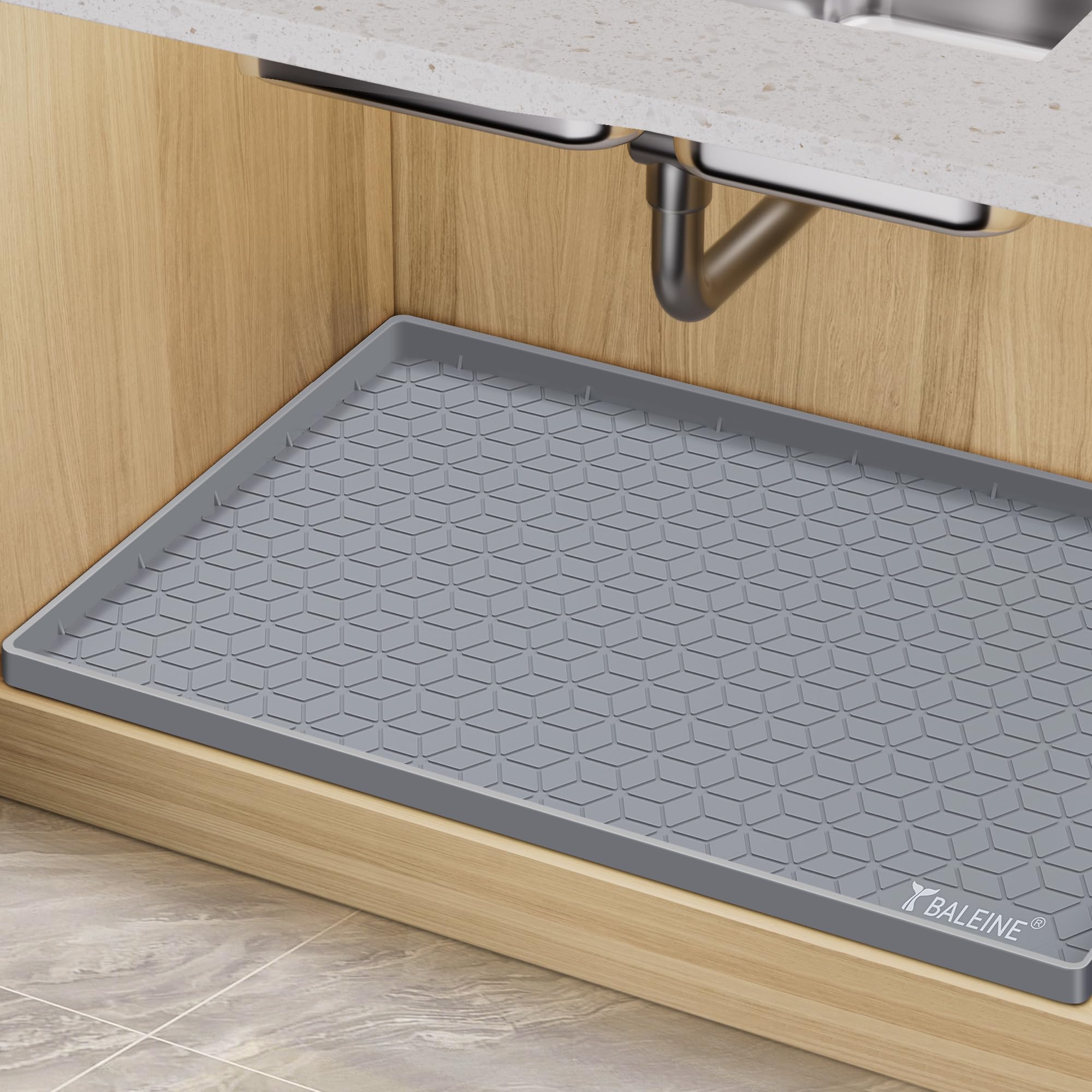 BALEINE charcoal under-sink mat protects cabinets from spills.