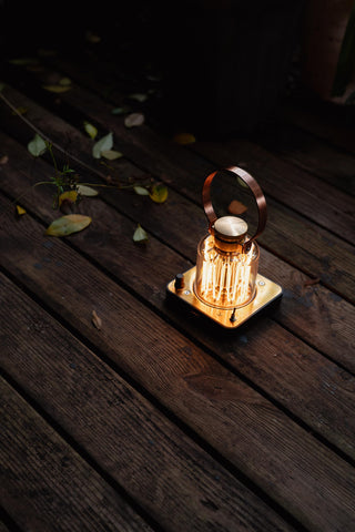 Large copper-finished handle on Barebones lantern for easy carrying.