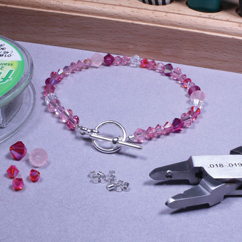 Beadsmith crimper kit workspace with tools organized for crafting