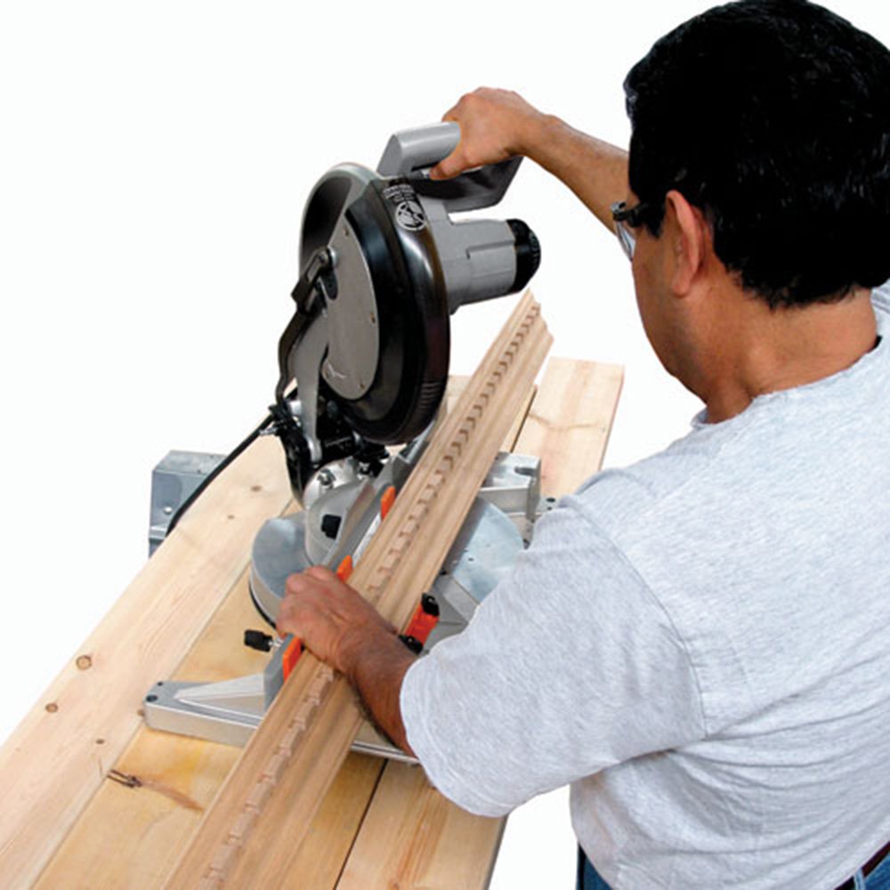 Bench Dog Cut Crown Molding Jig in-use view demonstrates built-in setup guidance.