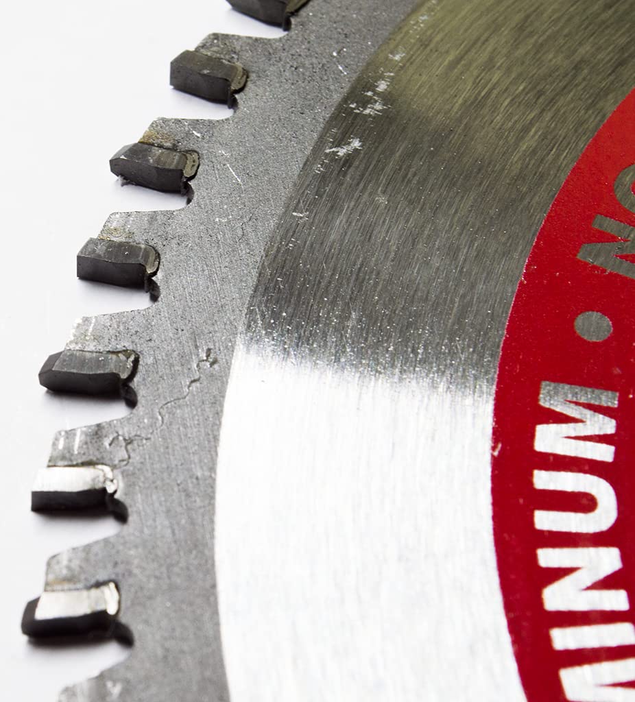 Benchmark Abrasives TCT blade cutting brass with precision results.
