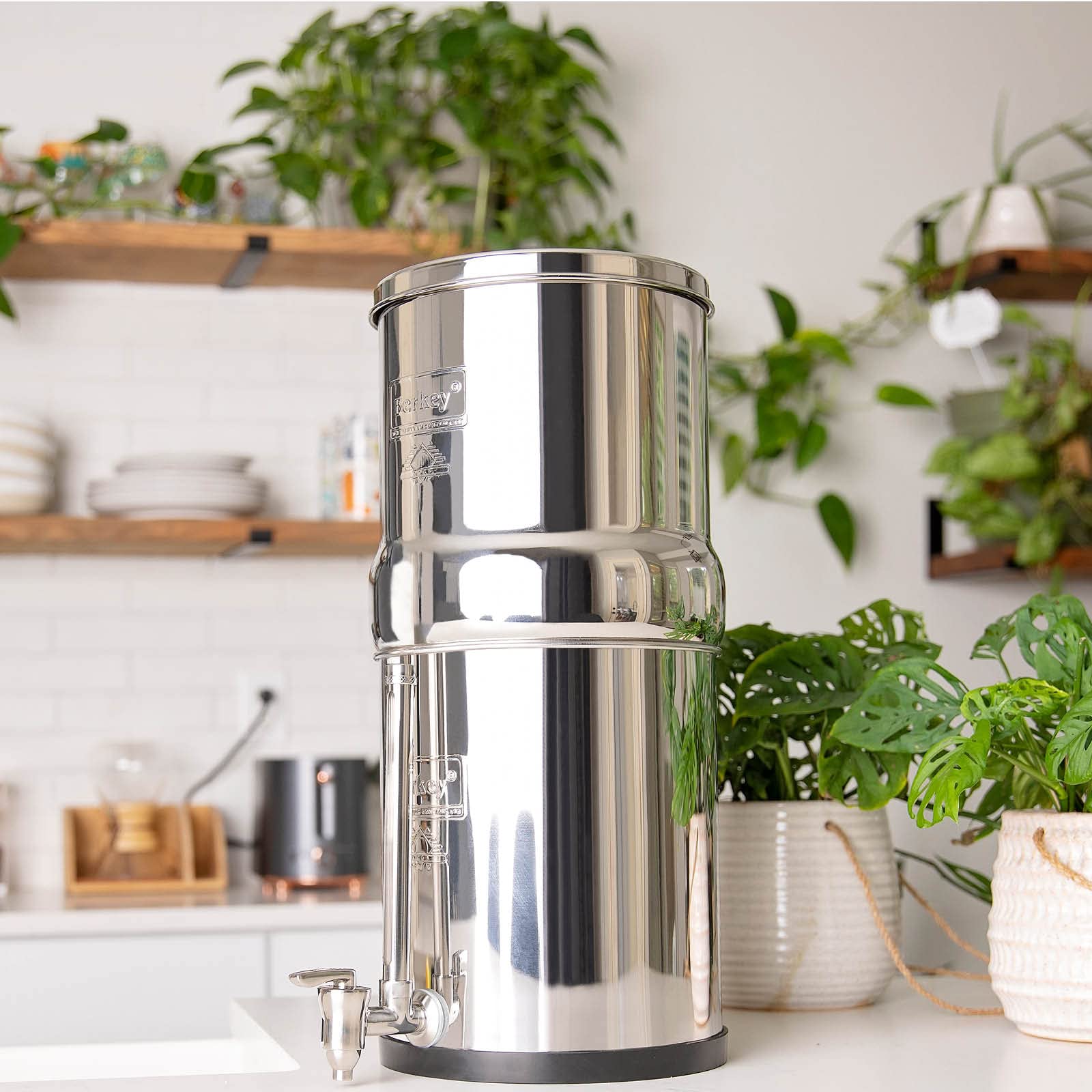 Pouring filtered water from the Berkey into a glass