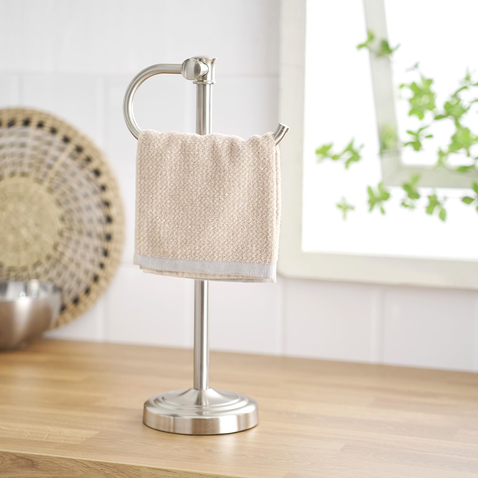 BESy bathroom towel organization stand helps keep vanity clutter-free.