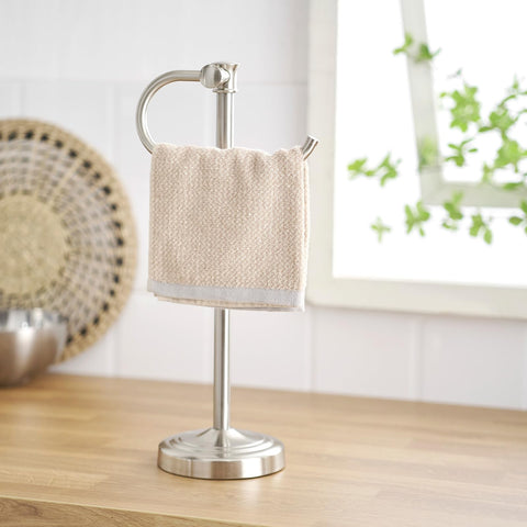 BESy bathroom towel organization stand helps keep vanity clutter-free.