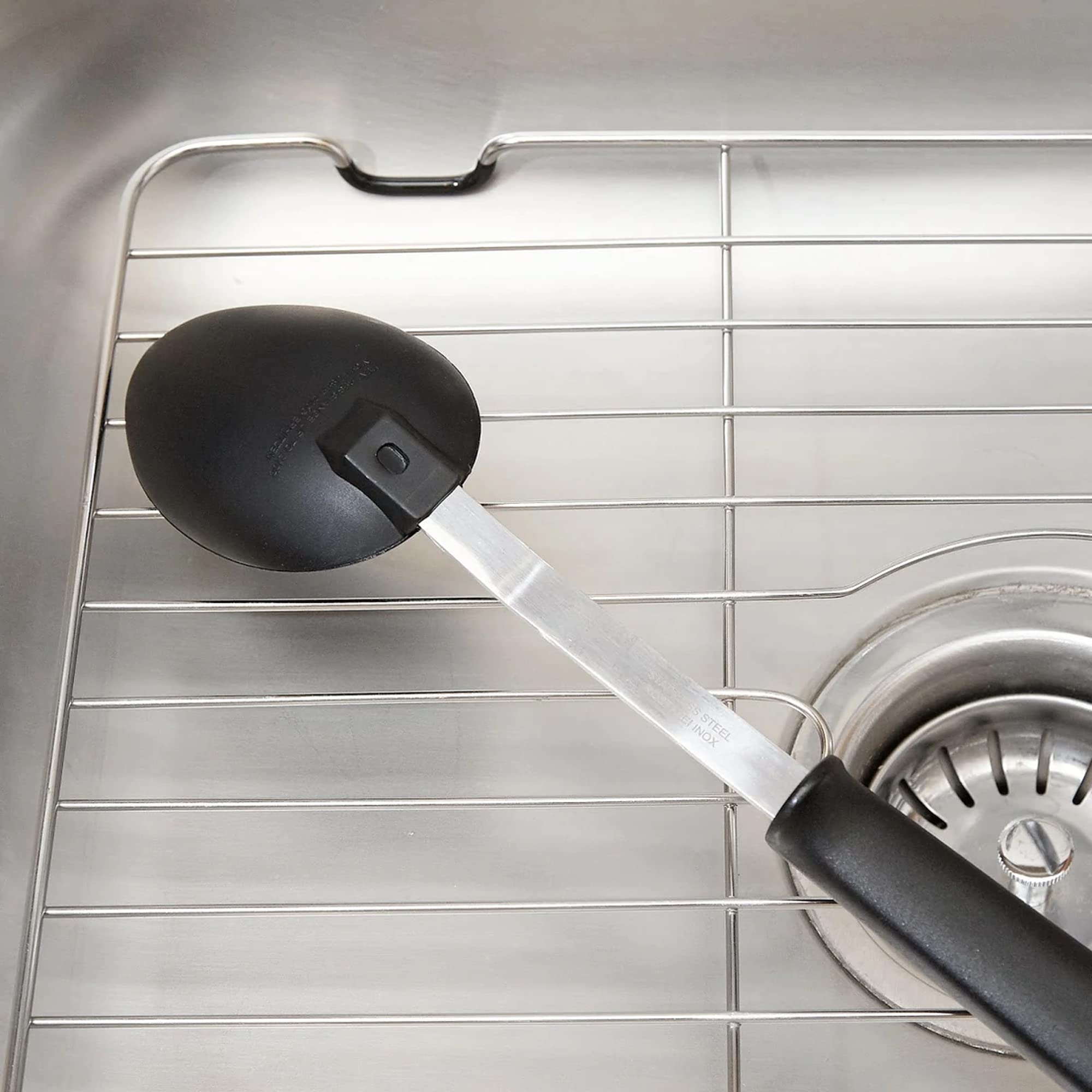 Better Houseware grid promotes drainage by elevating above sink bottom