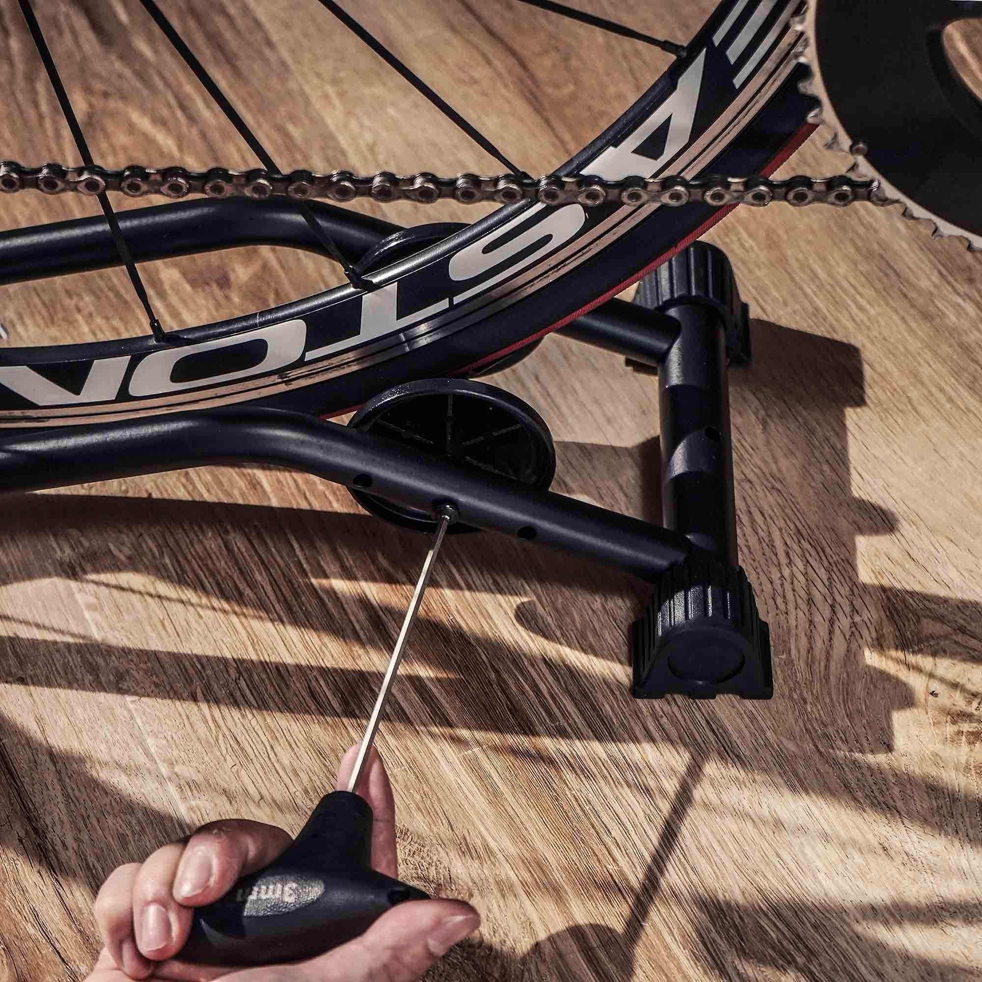 BikeHand in-use setup indoors beside tools for tidy storage