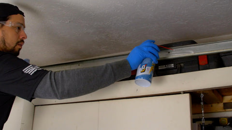 Direct spray on tracks with Blaster to prevent sticking.