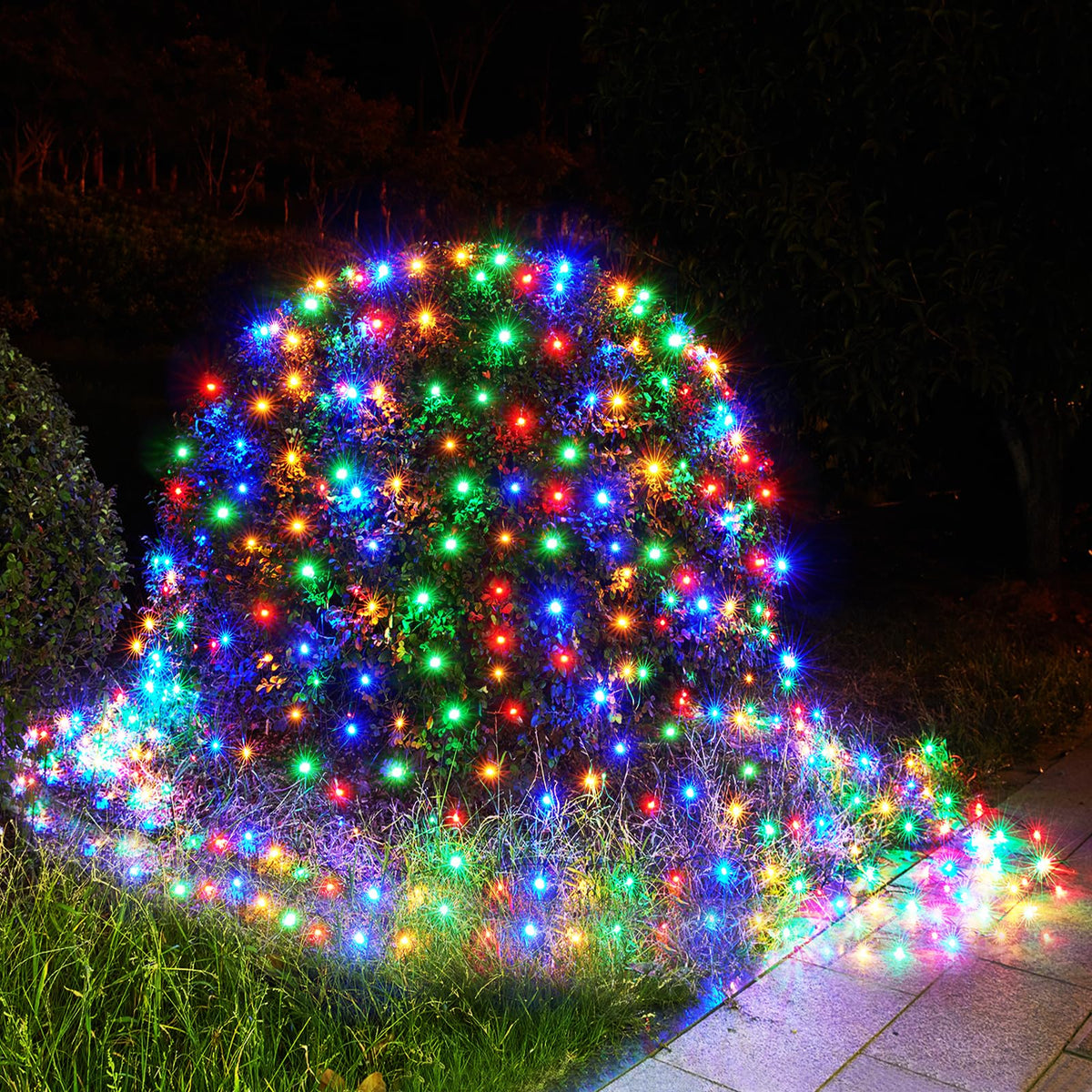 BlcTec outdoor Christmas net lights on a shrub for quick, vibrant exterior decoration.