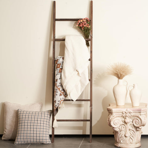Blossome blanket ladder exudes rustic charm as a decorative storage piece.