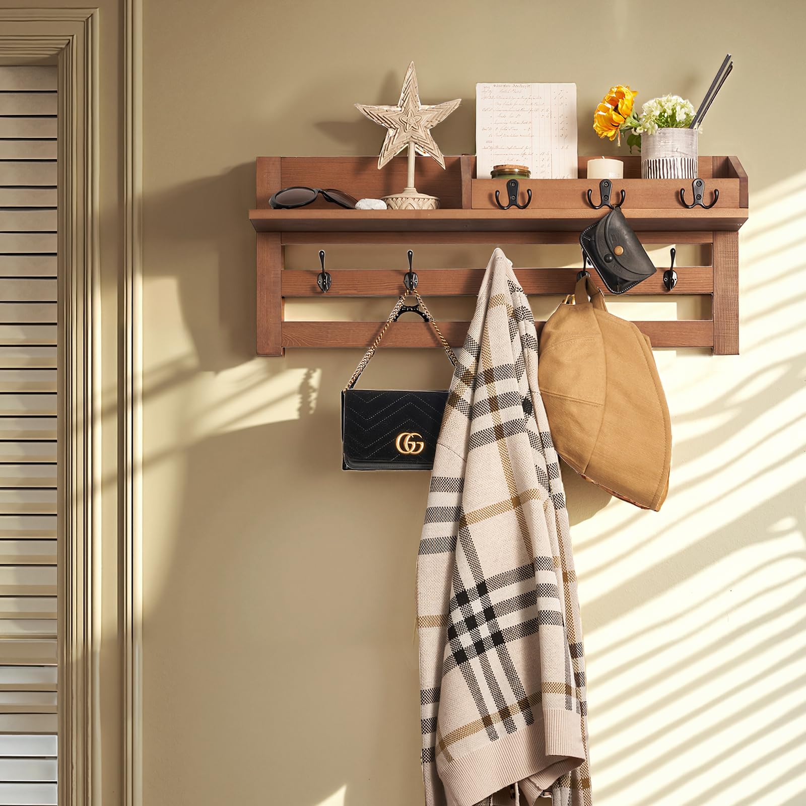 Blossome shelf compartment stores keys and wallets for quick access.