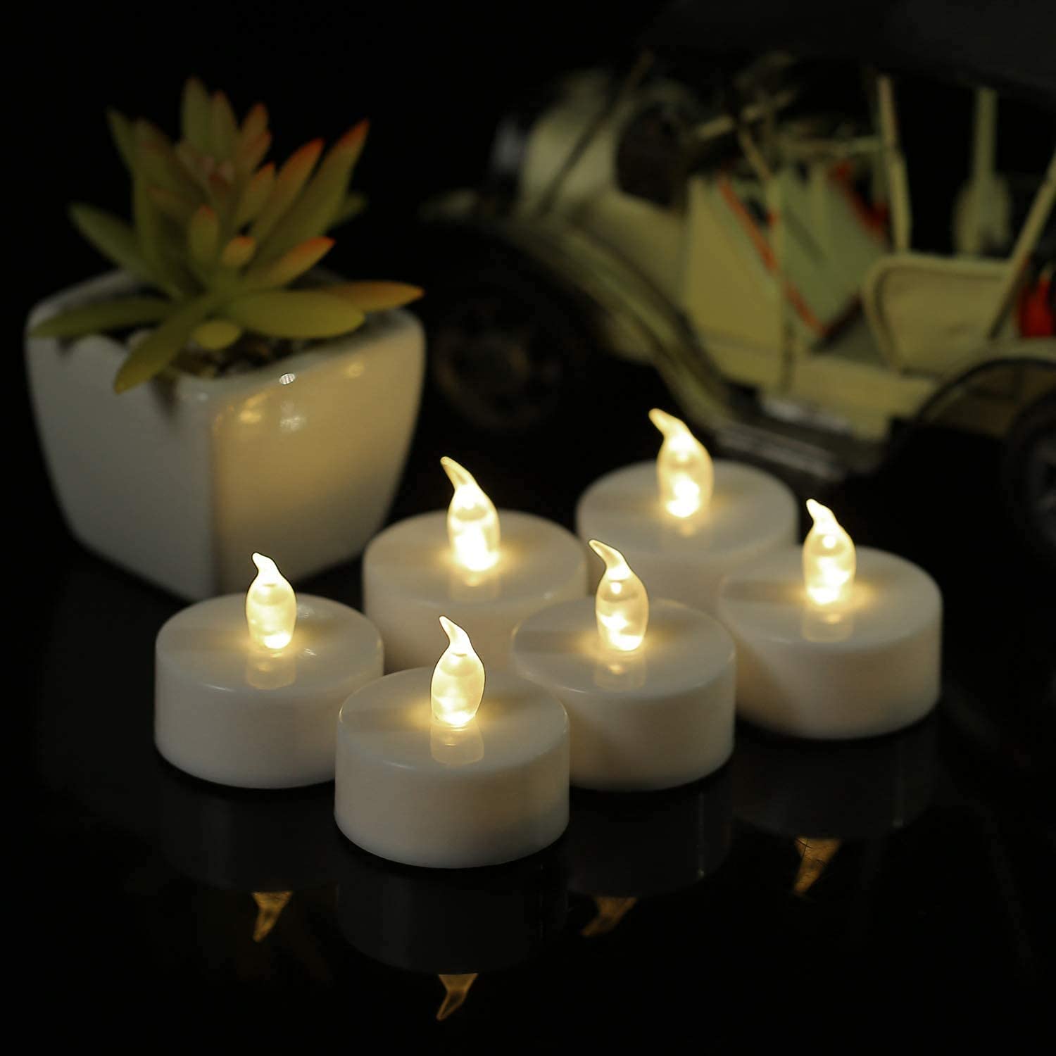 Boakboary tea light flickering LED close up highlights realistic flame effect.
