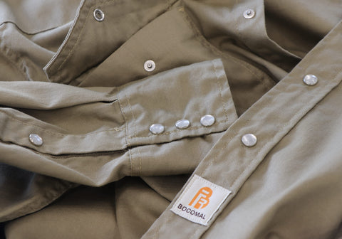 Navy fabric close-up showcasing soft feel and durable FR performance
