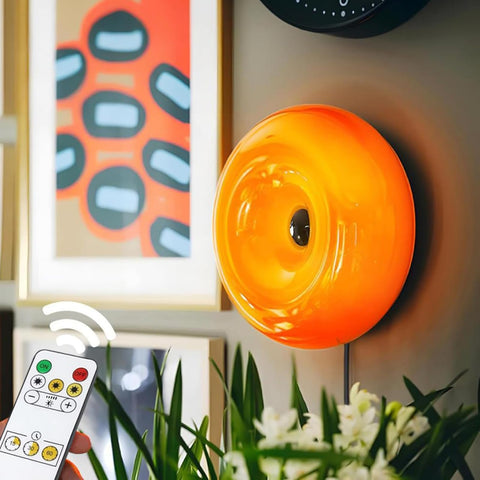 Bofea orange donut lamp wall sconce glowing softly in a cozy corner