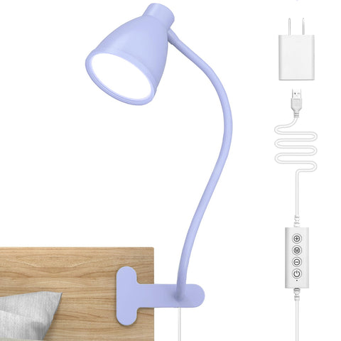 BOHON lilac desk lamp clipped to a bedside surface, ready for reading.