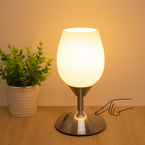 Boncoo small touch lamp on nightstand provides soft illumination for bedtime.