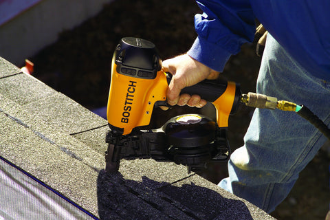 Bostitch RN46-1 nailer shown reloading the magazine for efficient use.