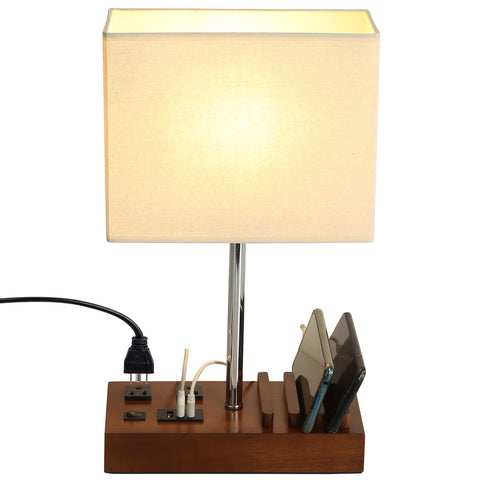 Briever USB table lamp with dual outlets for convenient bedside charging.