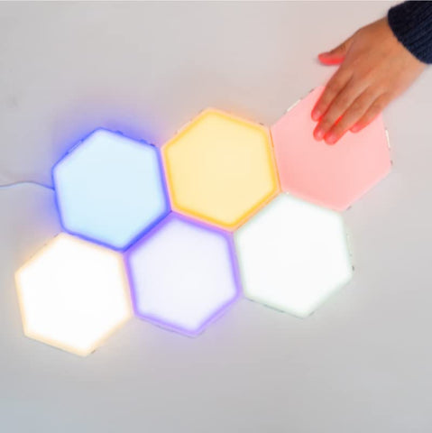 Bright Autism Tap-Tap hexagon magnets interlock to form creative shapes for play.