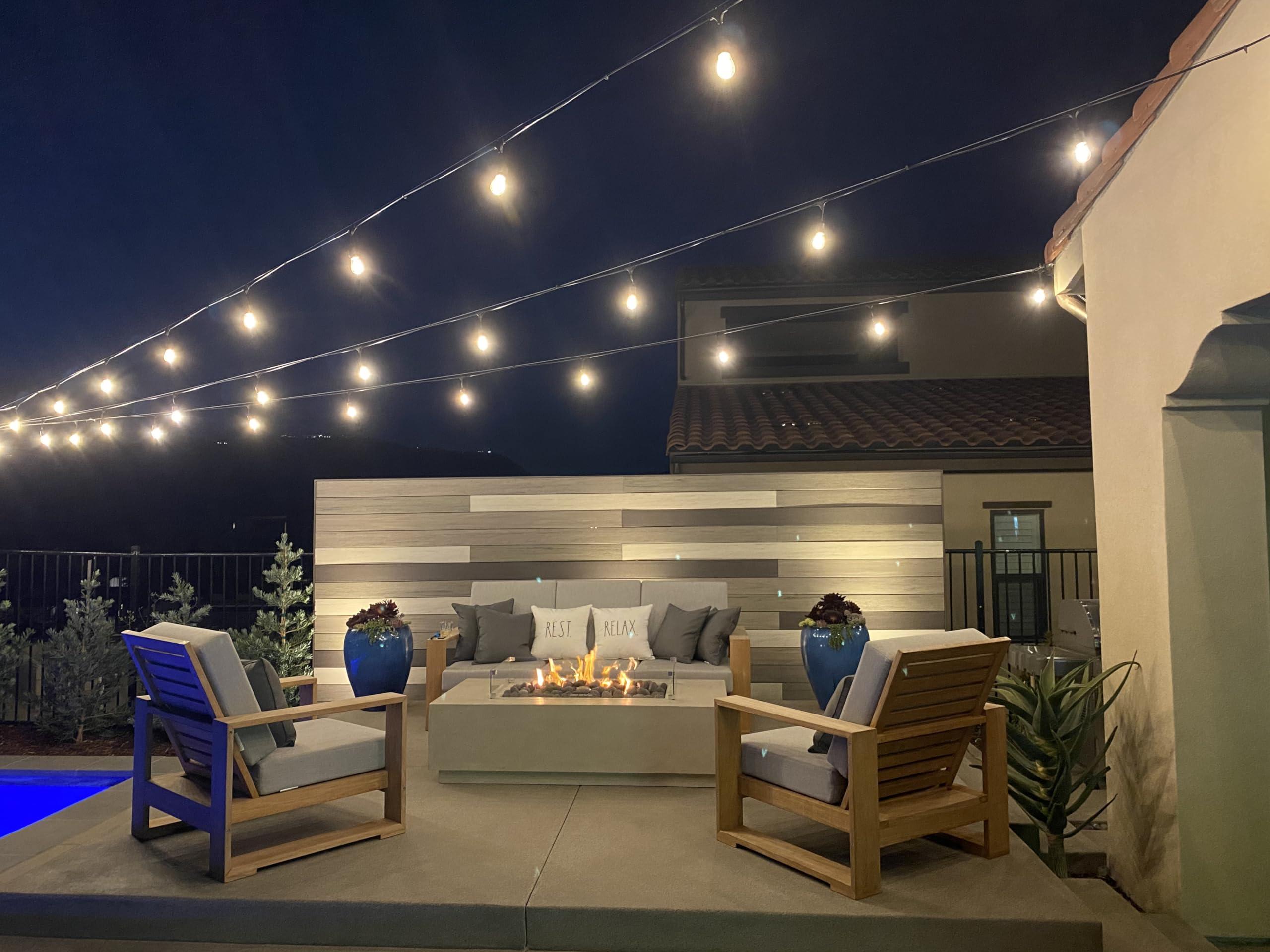 Brightech Ambience Pro canopy installation creates warm, inviting parties.
