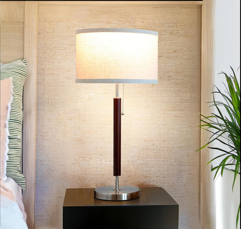 Brightech Carter bed lamp with diffused glow softly brightens late-night reading.