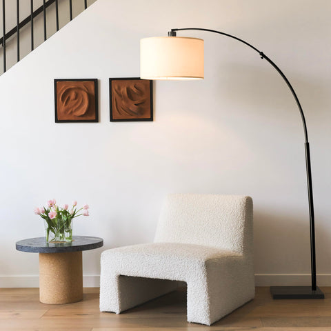 Logan Arc's 44-inch reach provides overhead light for sofas.