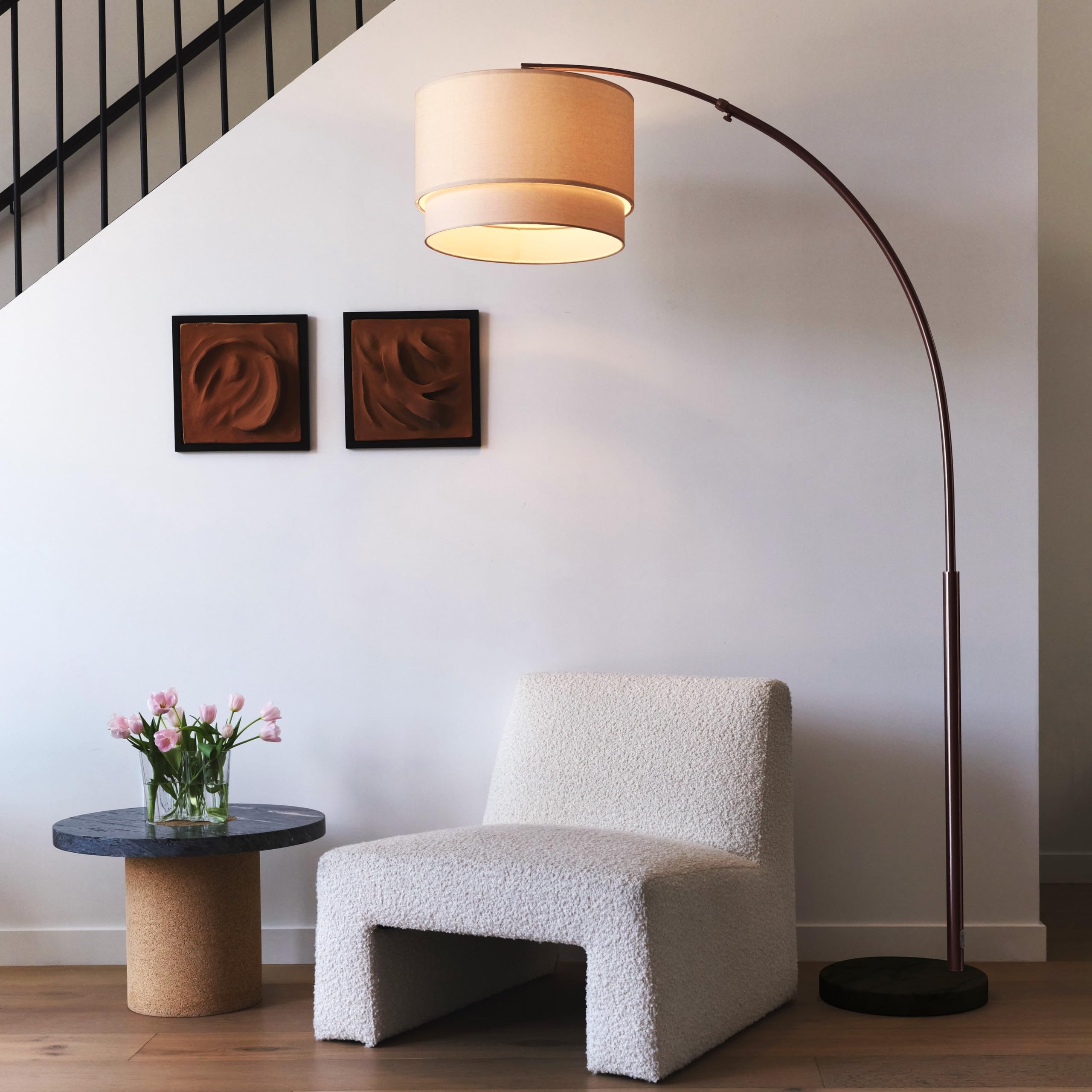 Brightech Mason Arc Lamp drum shade delivers soft ambient illumination for living rooms.