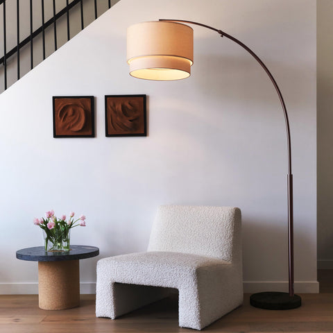 Brightech Mason Arc Lamp drum shade delivers soft ambient illumination for living rooms.