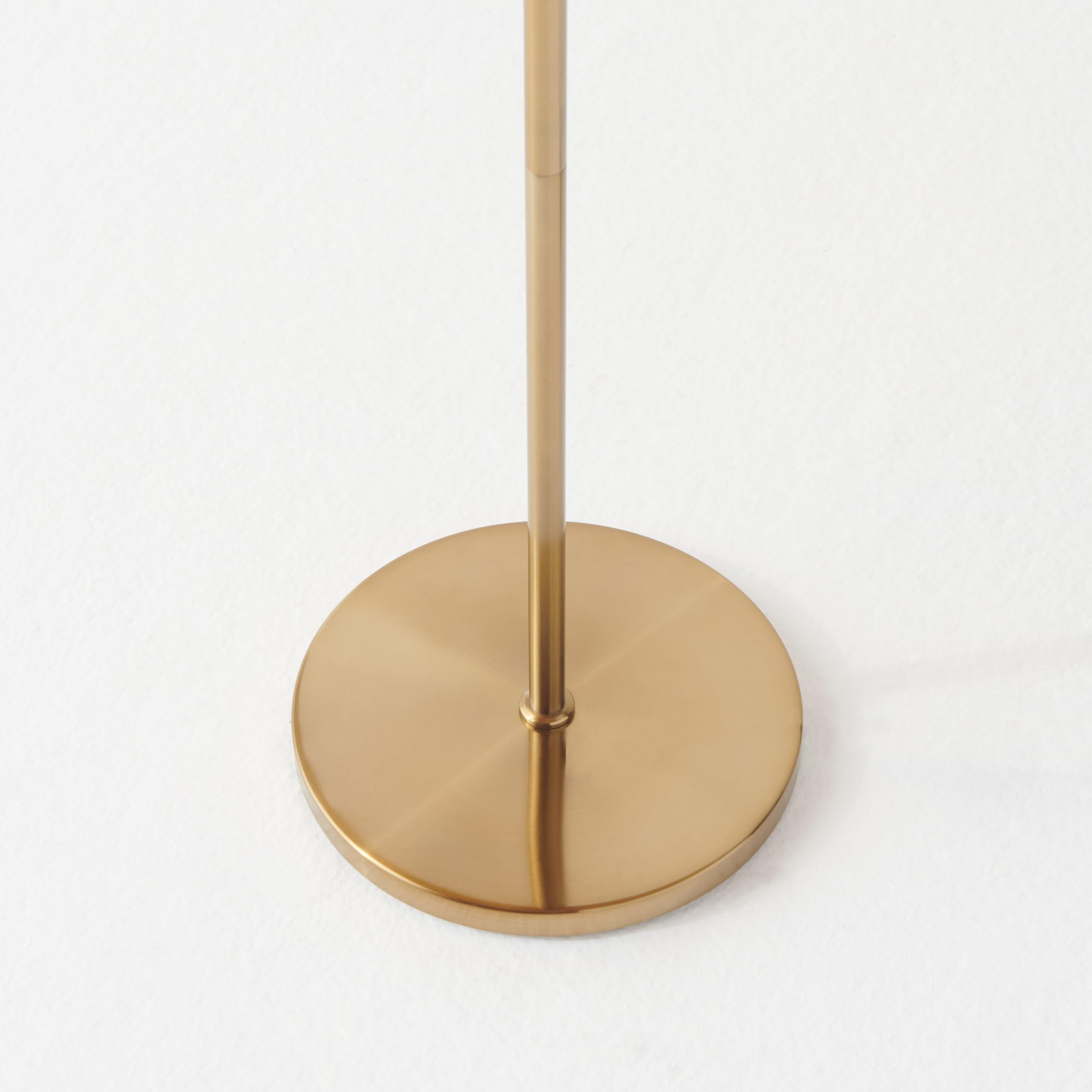 Brightech Nova arch lamp placed in living room creates focal ambiance.