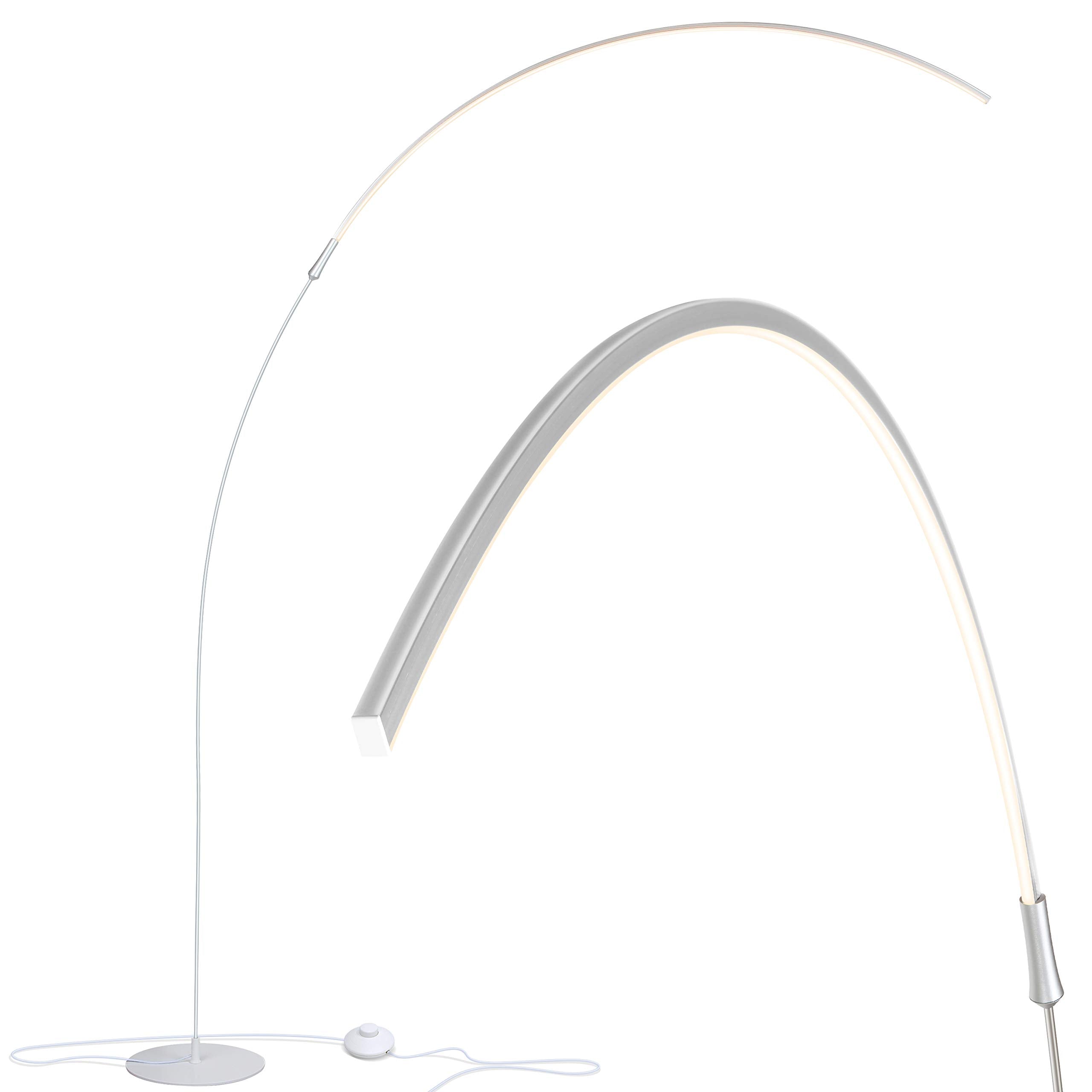 Brightech Sparq Arc floor lamp arches over a desk providing focused task lighting