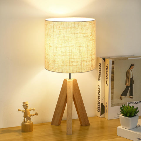 Brightever small table lamp with wooden tripod provides a compact, stylish bedside light.