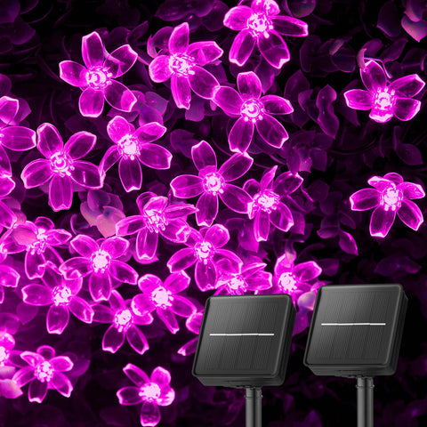 Brightown cherry blossom solar lights illuminate a garden setup with 52 feet of glow