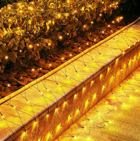 Brightown net lights on bushes with 360 LEDs deliver an even warm white glow.