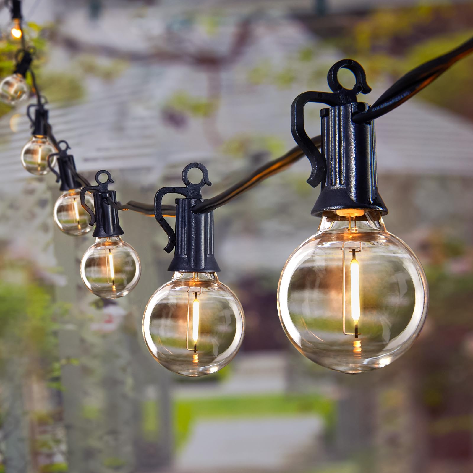 Brightown 69ft outdoor string lights illuminate a patio with warm glow