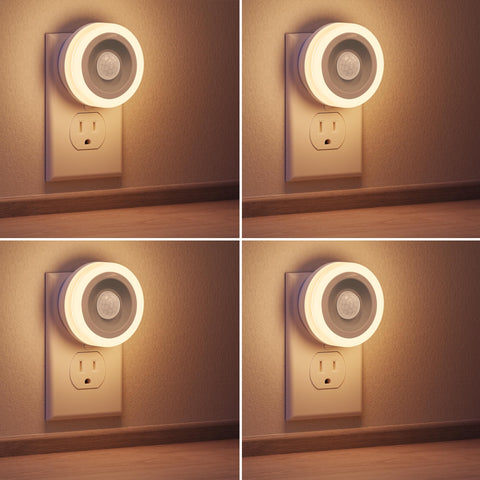 Briignite motion sensor night light plugged into wall outlet with warm glow