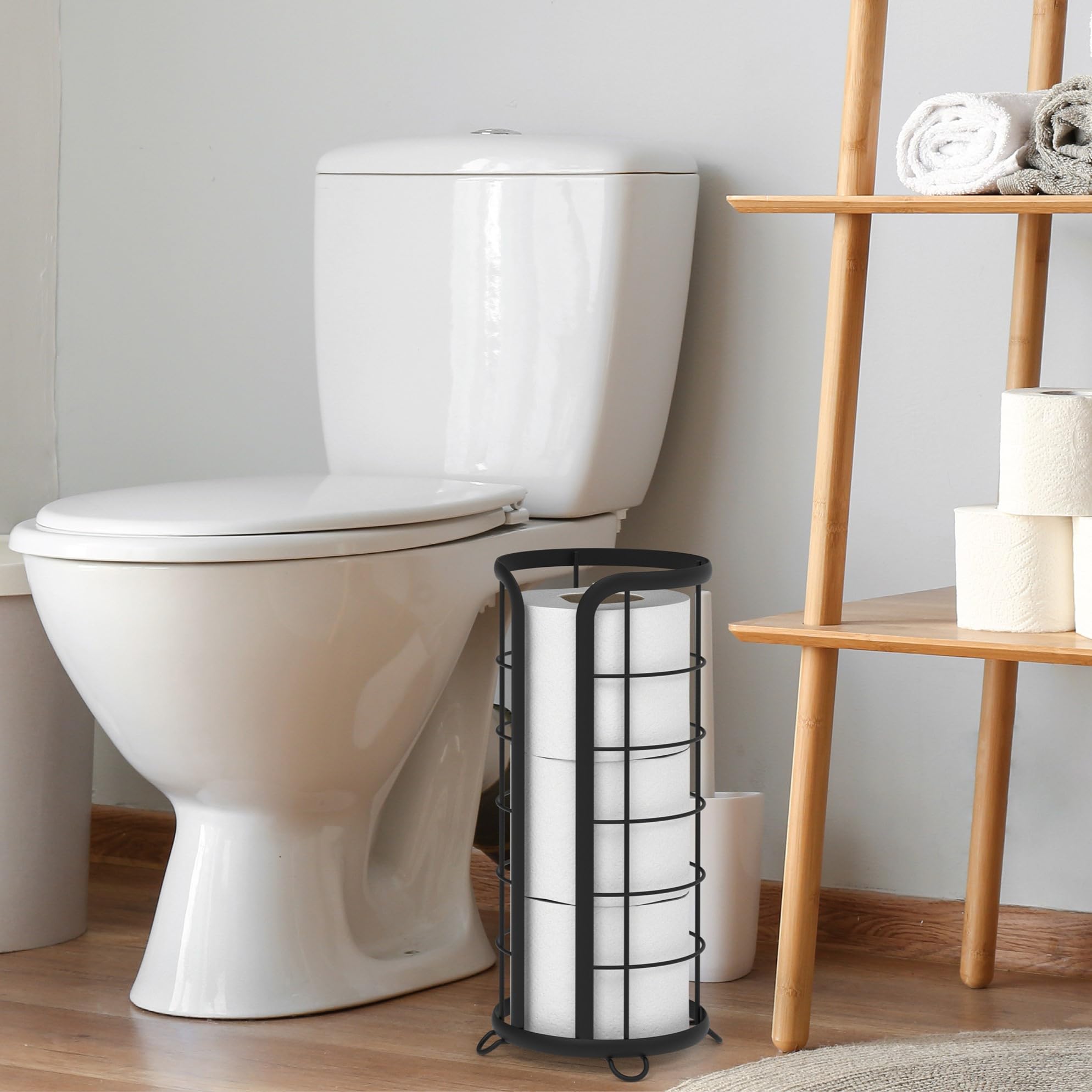 Brookstone black toilet paper holder in a modern bathroom scene