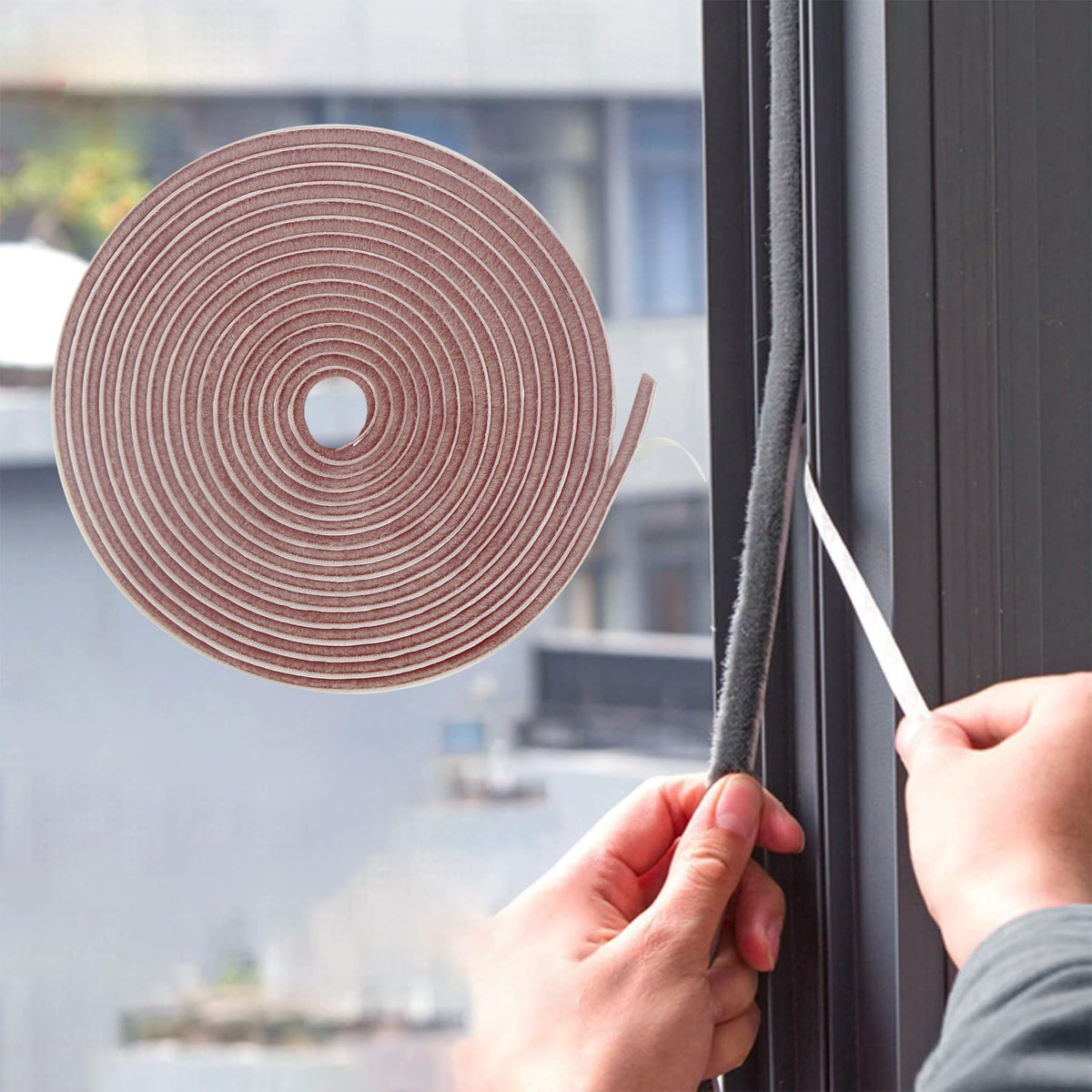 Bruiefpap weather strip adhesive roll in brown seals air gaps to reduce drafts.