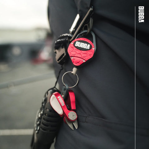 BUBBA Line Clipper Combo tether clipped to pocket for quick access