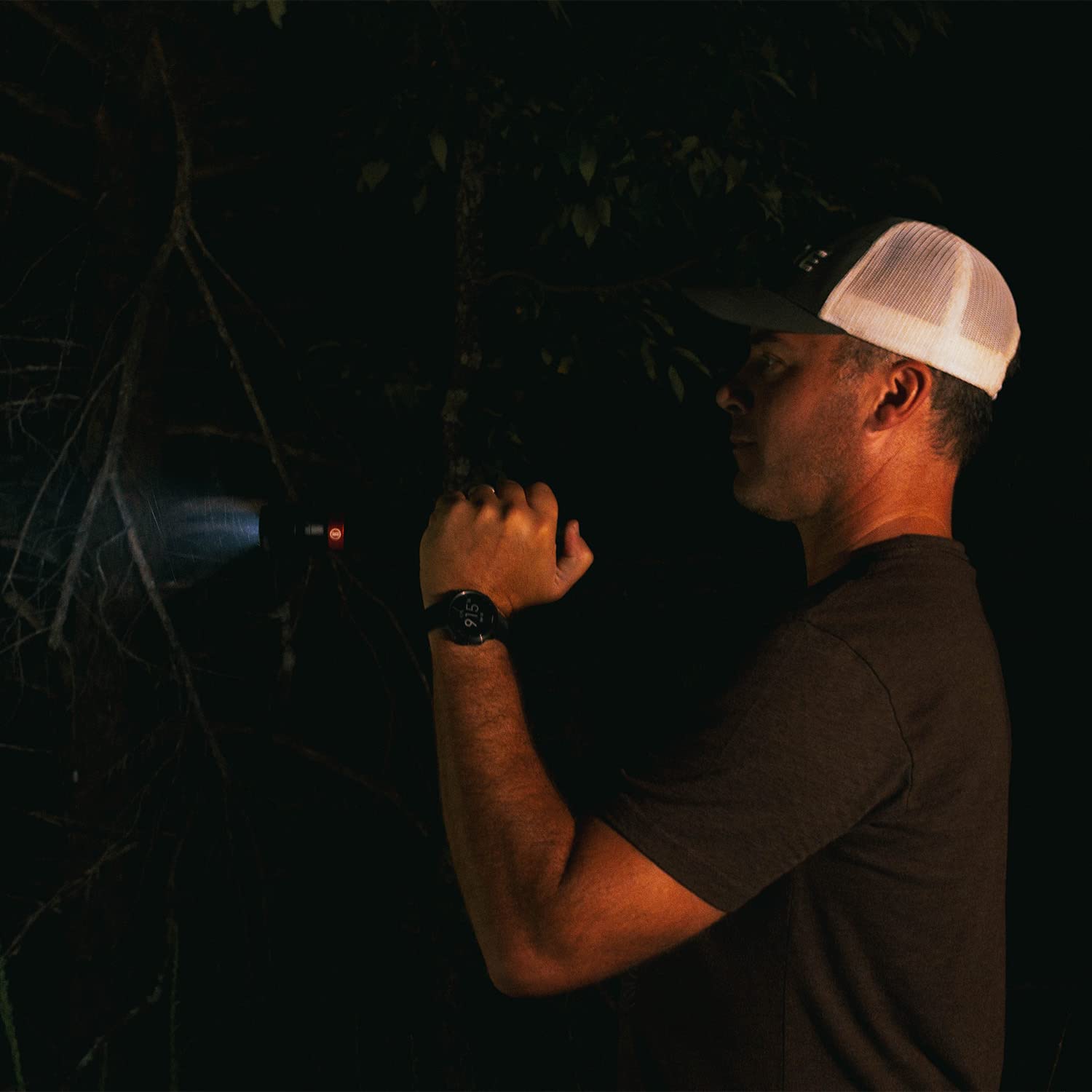 Bushnell handheld flashlight in use during outdoor activity