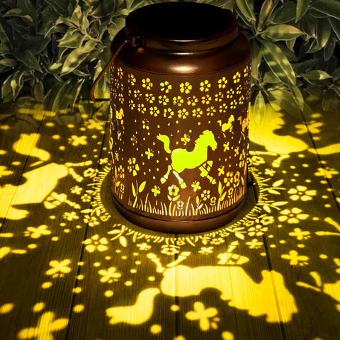 Buwheekoki horse lantern hanging on patio emits warm ambient light.