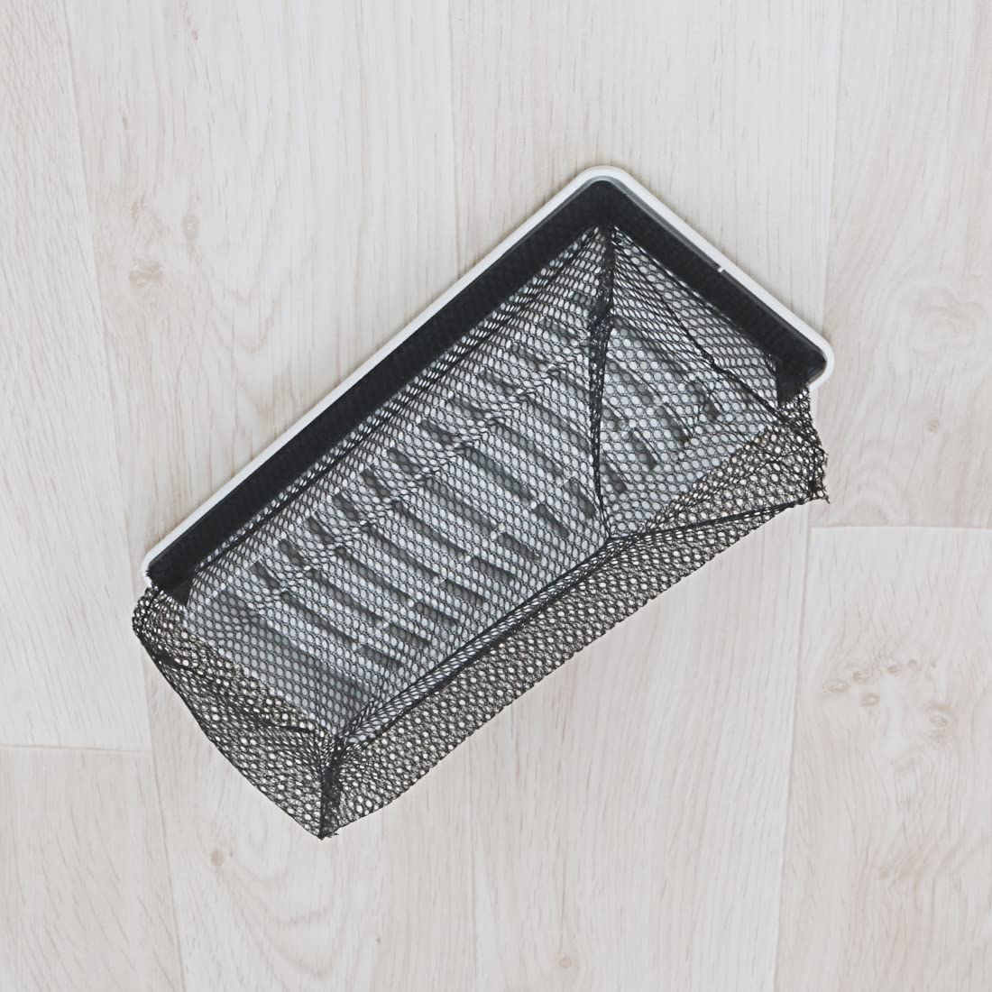 BYEWIRE vent trap in operation demonstrating air flow with screen