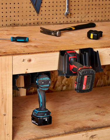 CADDY drill holder shows trigger guard to prevent accidental activation.