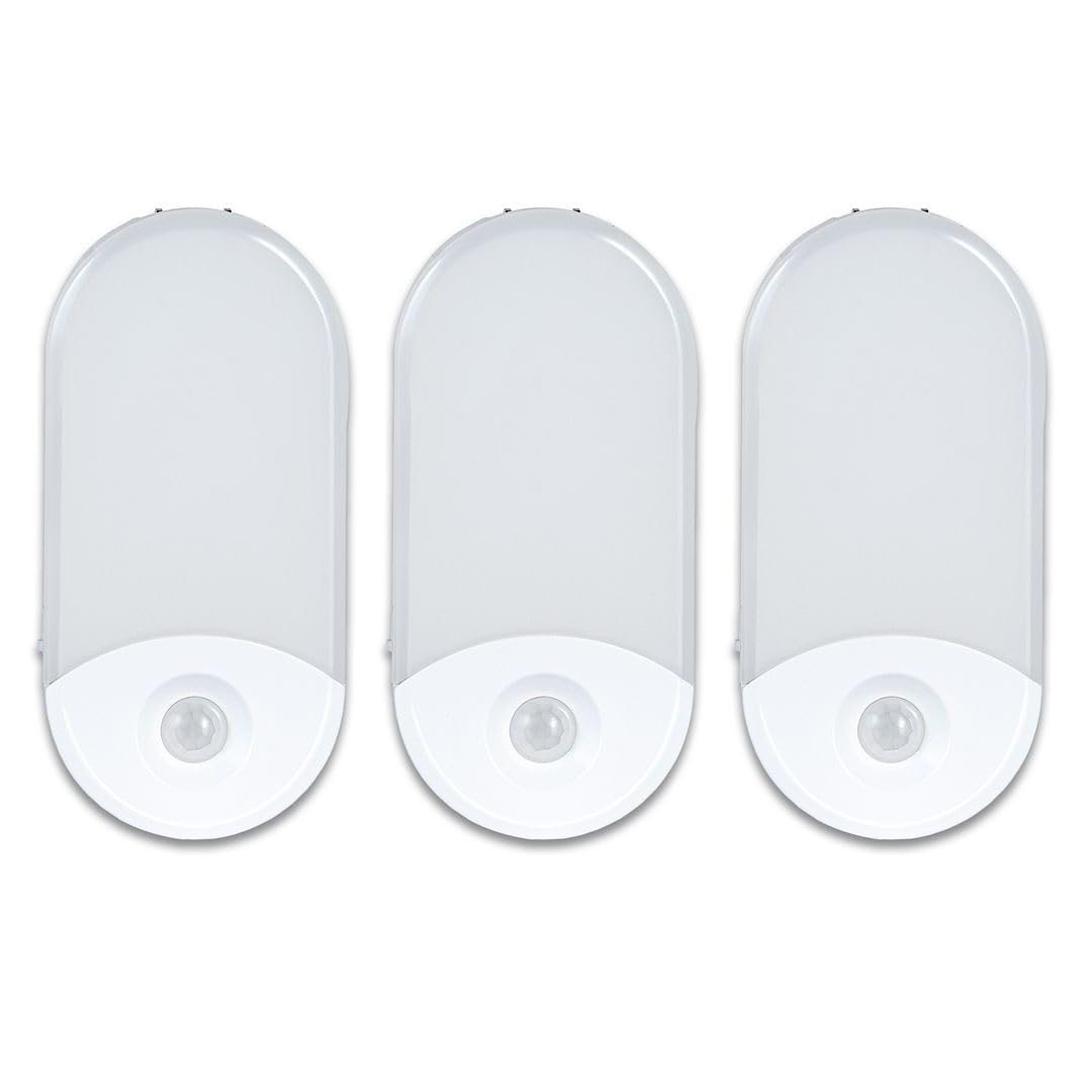 Camelion 3-pack 4-in-1 night light plugged into outlet for safe hallway lighting.