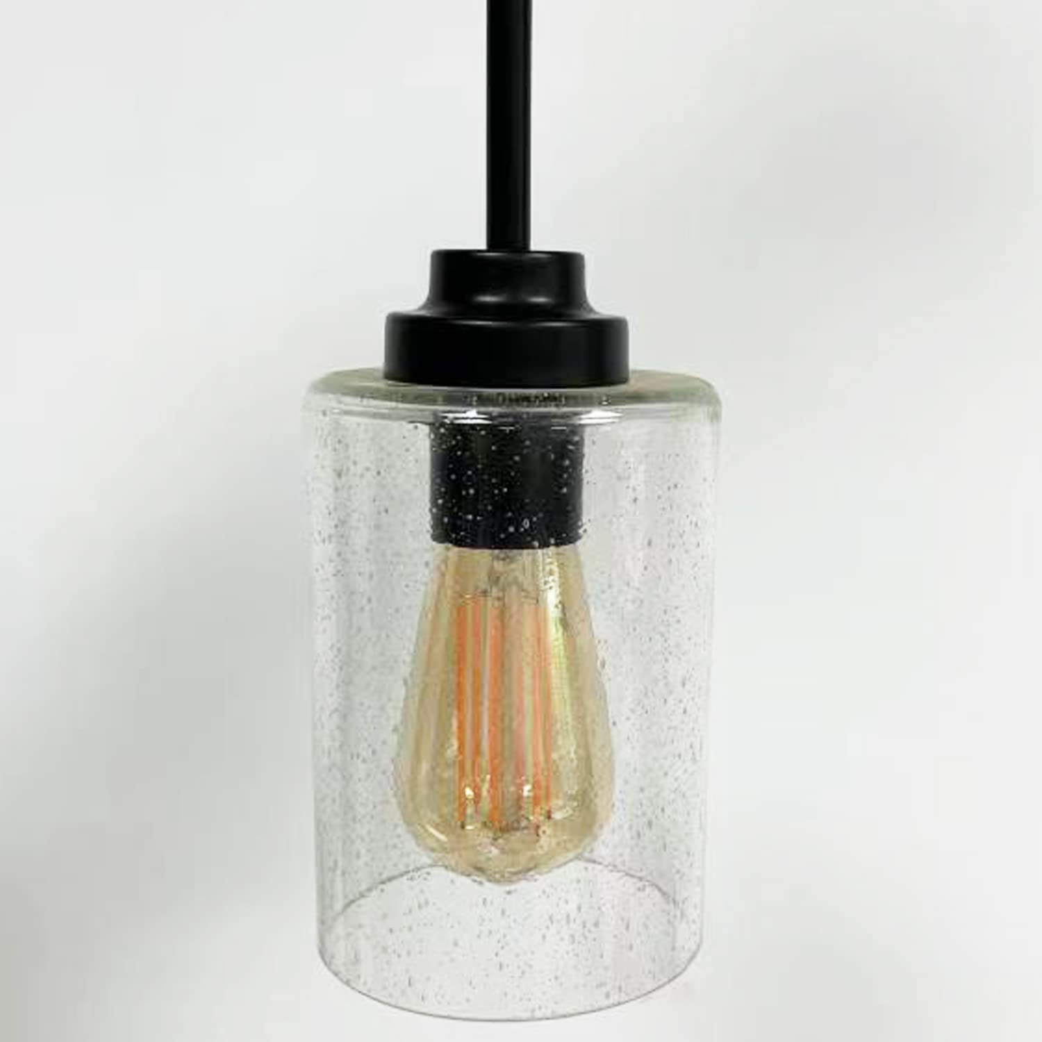 Canomo seeded bubble glass shade on a wall sconce for subtle glow