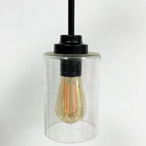 Canomo seeded bubble glass shade on a wall sconce for subtle glow