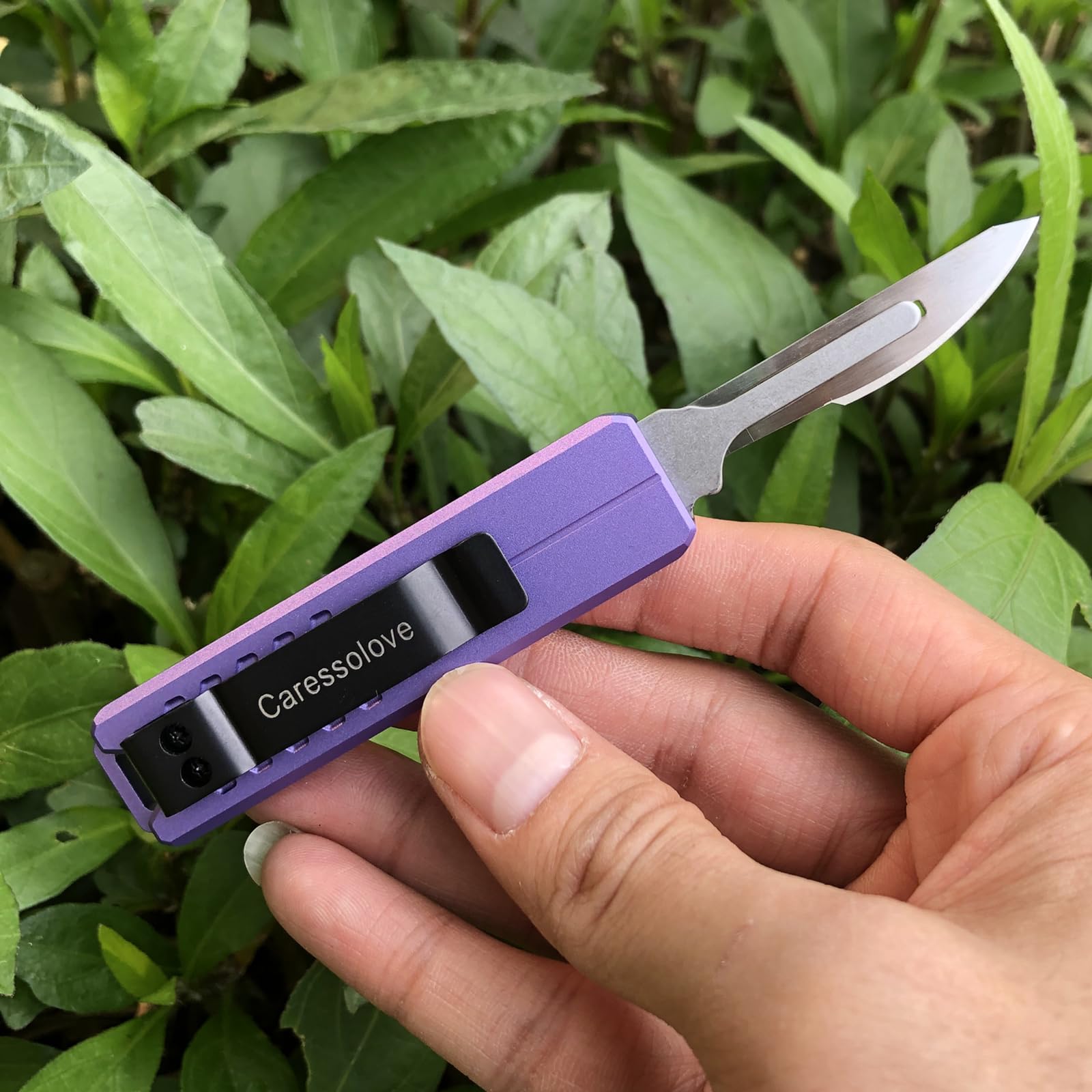 Caressolove exacto scalpel with precision blade for detail work.
