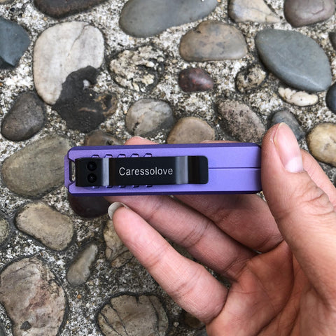 Caressolove purple box cutter highlighting safety features for efficient packaging.
