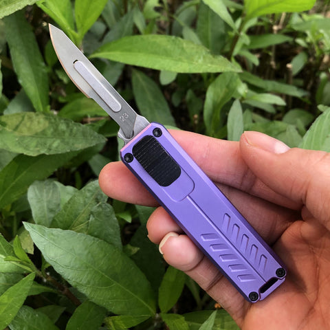 Caressolove purple knife close-up showing versatile blades for tasks.