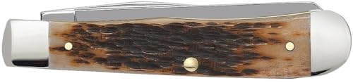 Close-up of amber bone handle showing peach seed jig texture on Case Trapper