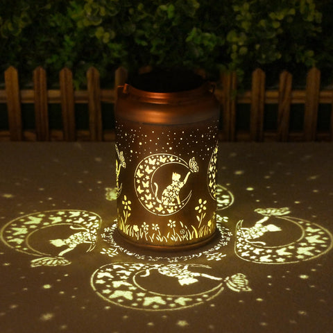 Cawalap Cat Solar Lantern hanging in garden with warm ambient glow